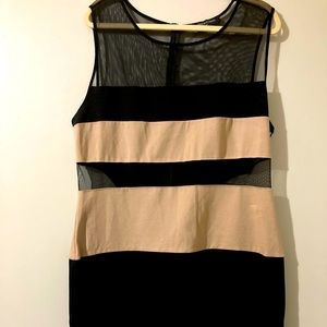 Two-toned bodycon dress with black netting and beige knit panels.